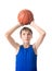 Joyful teenager holding a ball for basketball over his head. Is