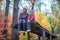 Joyful teenagers in the autumn forest