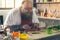 Joyful thick male chef enjoying food preparation