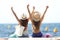 Joyful tourists on summer vacations on the beach