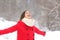 Joyful woman breathing fresh air enjoying snow