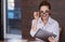 Joyful woman wearing glasses in an office