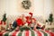 Joyful young family at home at Christmas on bed with New Years decorations for a traditional holiday