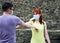 Joyful young man and woman greeting elbows instead of handshake