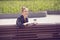 Joyful young woman having coffee break