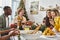 joyous multiethnic family enjoying holiday feast