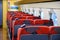 JR red seat on Japanese train JR shinkungzen colorful aisle seat E, JR train park on the track arrange to next station,seats are e