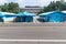 JSA within DMZ, Korea - September 8 2017: 5 UN soldiers and one normal soldier in front of blue buildings at North South Korean bo
