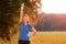 Jubilant young woman punching the air