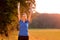 Jubilant young woman punching the air