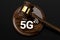 Judge gavel and 5G symbol. High speed network and legal issues concept. 3D rendering