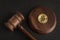 Judge gavel and bitcoin. Cryptocurrency legislation. Bitcoin ban. Violation of law