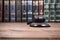 Judge Gavel on a black wooden background in front of law library