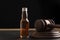 Judge gavel and bottle with whisky or other alcohol on black background. Alcohol and crimes concept