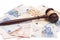 Judge gavel, euro banknotes and calculator