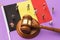 Judge gavel, flag of Belgium and plastic toy men on a colored background, the concept of litigation in the Belgian society