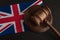 Judge Gavel and flag of United Kingdom. Law and justice in UK. Violation of rights and freedoms in Britain