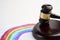 Judge gavel and LGBT rainbow on a white background