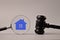 Judge gavel, magnifying glass and house symbol. Judge auction and real estate concept