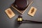 Judge gavel with a male and female wooden symbols on the black background