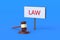Judge gavel near billboard with word law