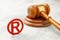 Judge gavel and red trademark sign grey