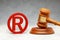 Judge gavel and red wood trademark sign