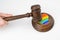 The judge hits a heart with a rainbow flag with a gavel.