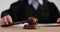 Judge knocks with wooden gavel in courtroom