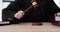 Judge knocks with wooden gavel putting hand on law books