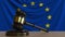 Judge`s gavel and block against the flag of the European Union. Court conceptual animation