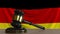 Judge`s gavel and block against the flag of Germany. German court conceptual animation