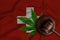 Judge\'s gavel and cannabis leaf on the Swiss flag background. The concept of legalization of marijuana in Switzerland