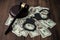 Judge\'s gavel with handcuffs on the background of dollar bills