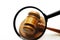 Judge\'s gavel and magnifying glass