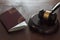 Judge`s gavel and passport on wooden table