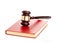 Judge\'s gavel on red legal book