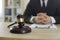 Judge's gavel on wooden office table of professional lawyer providing legal services
