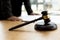 The judge`s hammer is placed on the table, the lawyer concept assumes that the defendant defends the client in order to win the