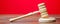 Judge`s hammer on a red background. The judicial system. Norms, rules and laws. Conflict resolution in court. Court case, settlin