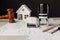 Judge wooden gavel, stamp and model of house with blueprint