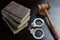 Judges Gavel, Handcuffs And Old Book On The Black Table