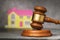 Judges gavel and house close-up, the concept of selling real estate at auction
