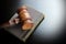 Judges Gavel And Old Book On The Black Wooden Table