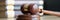 Judicial gavel and books in courtroom closeup