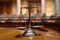 Judiciary concept scales of justice on wooden table in court