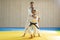 Judo man and judo girl are training judo throwing