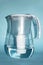 A jug for filtering water on a blue background