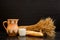 Jug, glass of milk, a loaf and a sheaf of ears on a black background