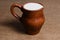 Jug of nutritious fresh milk from a farmer on the wooden table